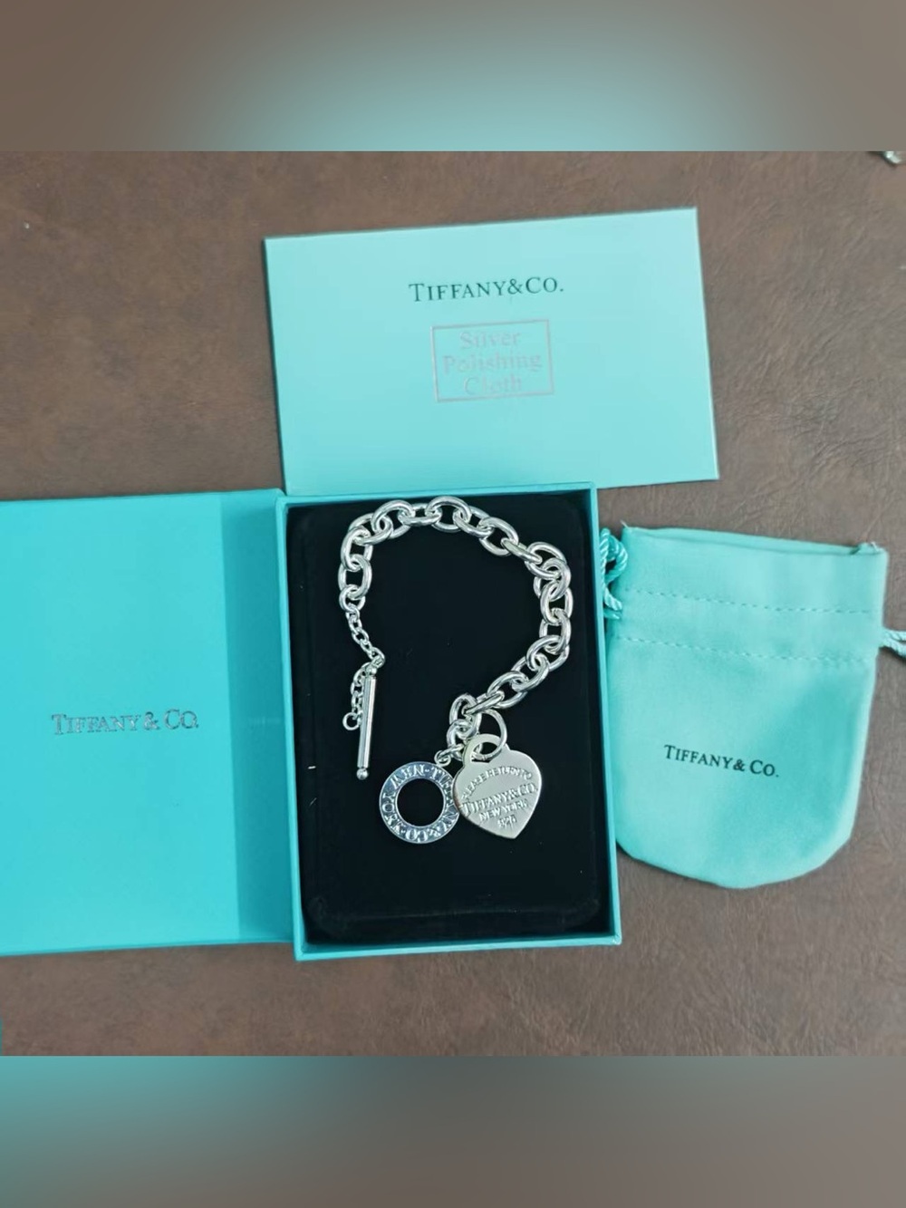Tiffany     &     Co.    . Silver Toggle Charm Bracelet with Blue-Green Pouch